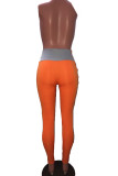 Pantalon slim orange à volants élastiques et patchwork
