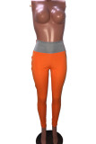Pantalon slim orange à volants élastiques et patchwork
