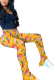 Pantalon coupe botte drapé jaune, blanc, jaune, violet clair, braguette à boutons, imprimé patchwork, personnage