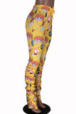Fondo dei pantaloni con taglio a stivale drappeggiato con stampa patchwork alta con bottoni bianchi gialli viola chiaro
