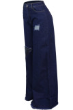 Pantalones sueltos asimétricos de agujero alto con cremallera de mezclilla azul oscuro