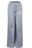 Pantalones sueltos asimétricos de agujero alto con cremallera de mezclilla azul oscuro