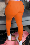 Оранжевые венецианские эластичные однотонные брюки-карандаш средней длины