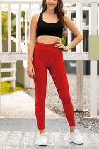 Pantalones pitillo rojos con bragueta elástica y color sólido