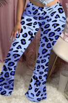 Pantalones con corte de bota y estampado de leopardo medio con bragueta elástica azul