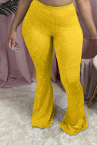 Parte inferior de pantalones con corte de bota de color amarillo con bragueta elástica y color sólido