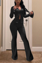 Pantalones sueltos de color negro con bragueta elástica y manga larga
