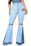 Jeans com buracos quebrados azul claro