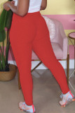 Pantaloni a matita alti e solidi rossi elasticizzati