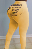 Pantalones pitillo con estampado elástico y mosca amarilla