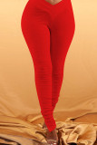 Pantalones de lápiz drapeados divididos sólidos con estampado alto de mosca elástica de punto rojo