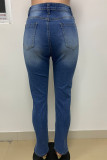 Denim blu scuro con fori rotti