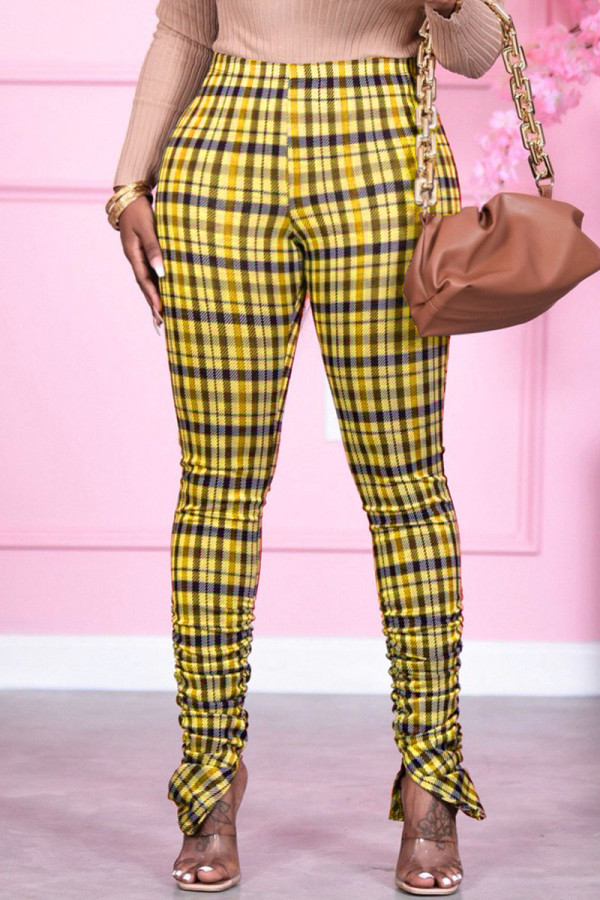 Желтые модные брюки скинни со складками и принтом