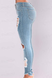 Lichtblauwe, modieuze, casual, effen skinny jeans met gescheurde middelhoge taille