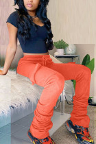 Pantalones de retazos con corte de bota y pliegues de bolsillo sólido casual naranja