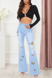 Babyblauwe mode casual vlinderprint gescheurde mid waist boot cut jeans