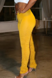 Желтые повседневные однотонные облегающие брюки с завышенной талией и динамиком в сложенном виде