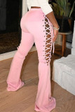 Pantalon de mode décontracté solide à bretelles évidées coupe botte taille mi-haute rose