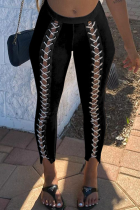Pantalones pitillo de cintura media ajustados con vendaje sólido sexy negro