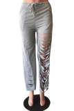 Pantalones holgados con cordón medio y agujero gris