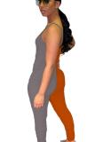 オレンジのセクシーなファッションソリッドパッチワークノースリーブスリップジャンプスーツ
