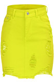 Желтая джинсовая застежка-молния и пуговицы Fly Высокая асимметричная лоскутная юбка трапециевидной формы с отверстиями для стирки Юбки