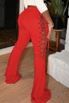 Pantalones de cintura media con diseño de correa ahuecada sólida casual de moda rojo