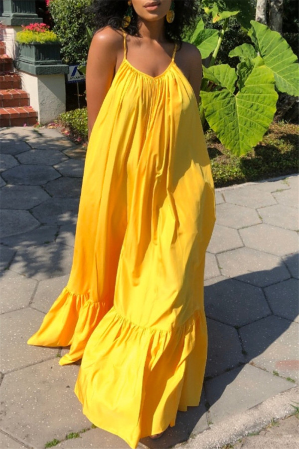 黄色のセクシーなカジュアルソリッドバックレススパゲッティストラップルーズスリングドレス