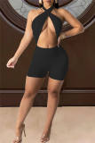 Macacão skinny preto sexy sólido vazado sem costas com design halter