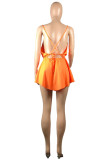 オレンジ色のファッションセクシーなソリッドバックレススパゲッティストラップノースリーブドレス