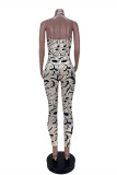 Beige Fashion Sexy Print Hollowed Out Backless Halter Skinny Jumpsuits