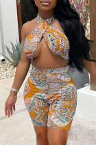 Yellow Fashion Sexy Print Hollowed Out Backless Halter Skinny Romper