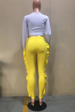 Pantaloni tinta unita giallo casual a balza a vita media skinny a matita