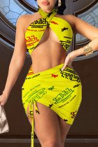 Estampado sexy de moda amarillo ahuecado sin espalda halter sin mangas de dos piezas