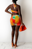 Oranje sexy print uitgeholde halter onregelmatige jurk jurken