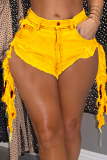 Yellow Sexy Solid Patchwork Low Waist Hot Pants Fringed Tassel Denim Shorts
