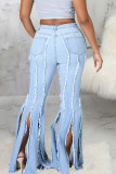 Голубые уличные однотонные джинсы с разрезами в стиле пэчворк