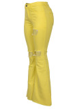 Pantalones vaquero con cremallera y botones con cremallera y abertura en el medio del remiendo del agujero amarillo