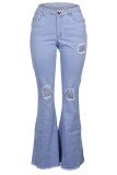 Pantaloni con taglio a stivale patchwork con foro centrale e cerniera lampo blu