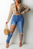 Jeans skinny a vita alta scavati con fasciatura solida casual alla moda blu medio