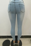 Babyblauwe casual, effen skinny jeans met gescheurde middelhoge taille