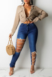 Jeans skinny a vita alta scavati con fasciatura solida casual alla moda blu medio