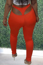 Pantalones pitillo de cintura media ahuecados sólidos casuales sexy naranja