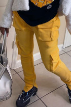 Calças retas retas dos retalhos da cintura alta reta do bolso amarelo dos retalhos da rua