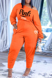 オレンジ ファッション カジュアル レター プリント ポケット 斜め襟 長袖 XNUMX ピース