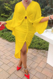 Vestidos de manga comprida assimétricos com decote em V amarelo moda sólida e vazada