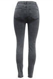 Calça jeans preta fashion casual rasgada com cintura média regular