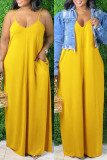 黄色のセクシーなカジュアルなソリッドバックレススパゲッティストラップロングドレス