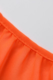 Orangefarbenes, sexy, solides, rückenfreies, ärmelloses Kleid mit Spaghettiträgern
