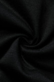 Schwarzer O-Ausschnitt mit langen Ärmeln. Kopfporträt. Patchwork-Pailletten-Langarmshirts